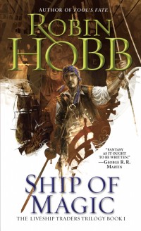 A sailor stands at the head of a ship. The text reads "Author of Fool's Fate, Robin Hobb, Ship of Magic, The Liveship Traders Trilogy Book 1, "Fantasy as it ought to be written." - George R. R. Martin'
